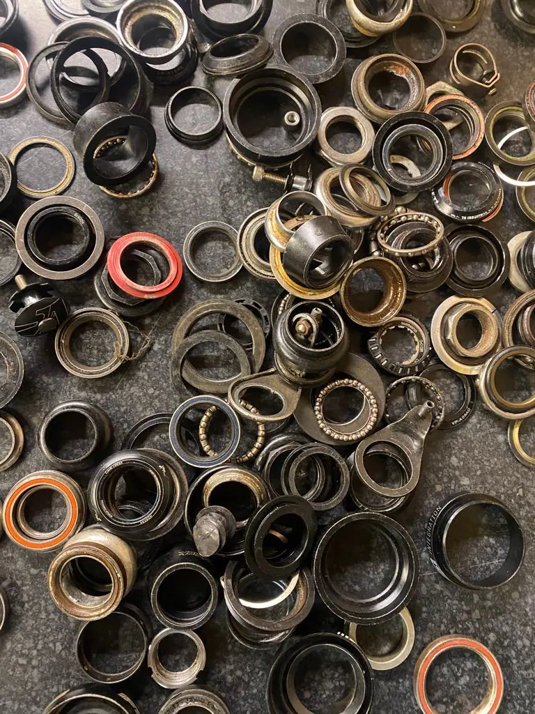 A tray of headset and bottom bracket bearings
