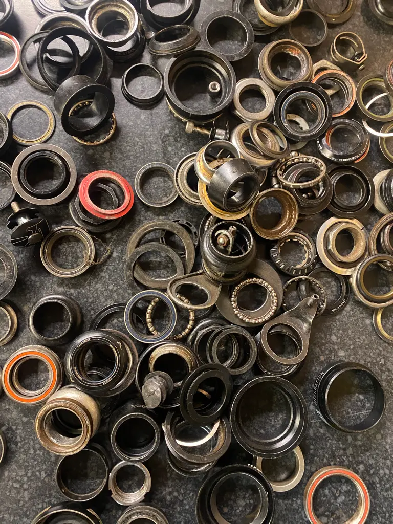 A tray of headset and bottom bracket bearings